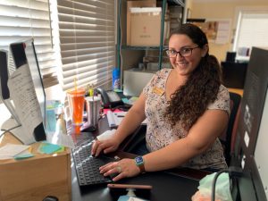 Wedding Director Alison Janigian rocking online chat and customer service while on hold with weddings.